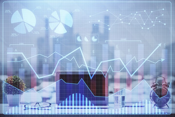 Stock market chart hologram drawn on personal computer background. Multi exposure. Concept of investment.