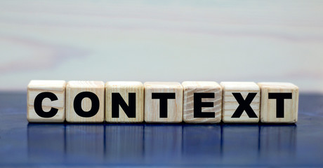 concept words context on cubes on a wooden background