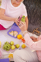 Obraz na płótnie Canvas Happy old ladies enjoying their healthy picnic