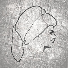 Face profile view. Elegant silhouette of a female head wearing fur hat. Beautiful woman portrait.