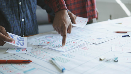 Designers man drawing (UX) (UI) Graphic designer creative sketch planning application process development prototype for responsive web desig