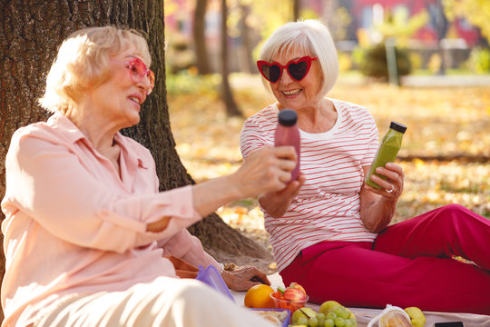 Happy women discussing their ways of healthy lifestyle