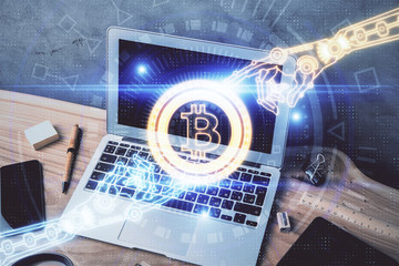 Double exposure of blockchain theme hologram and table with computer background. Concept of bitcoin crypto currency.