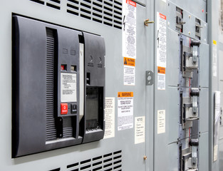 Main power breaker in electrical room of residential or commercial building. Insulated case circuit...