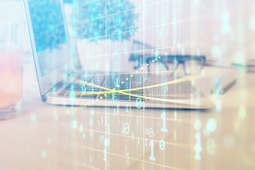 Double exposure of laptop computer and technology theme hologram. Concept of freelance work.