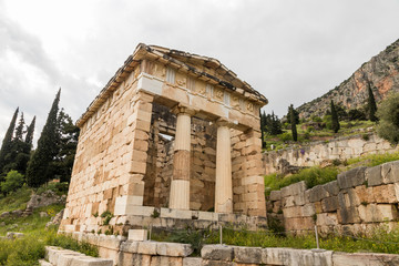 Fototapeta na wymiar Delphi, Greece. The Treasury of Athens, one of the buildings of the ancient Sanctuary of Apollo in Delphi
