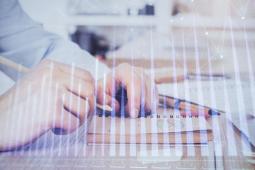 Multi exposure closeup hands with stock market forex graph.