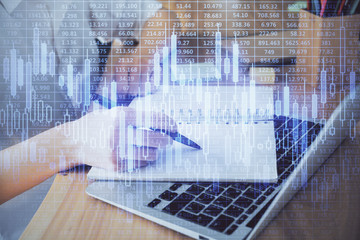 Financial charts displayed on woman's hand taking notes background. Concept of research. Double exposure