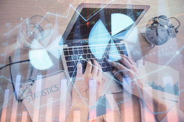 Multi exposure of forex graph with man working on computer on background. Concept of market analysis.