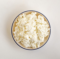 Farmer's cheese on white background from above