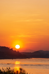 Scenic View Of Landscape Against Sky During Sunset