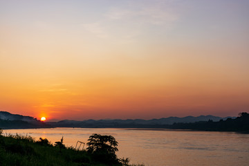 Scenic View Of Landscape Against Sky During Sunset