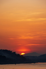 Scenic View Of Landscape Against Sky During Sunset