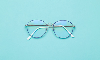 Eye glasses isolated on blue background.