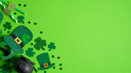 St Patricks Day banner design with Irish elf hats, pot of gold, shamrock and four-leaf clovers on...