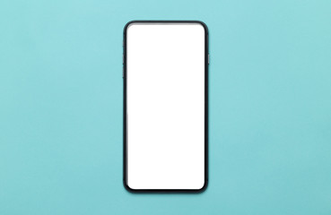Black smartphone with blank screen mockup isolated on blue background. Clipping path.