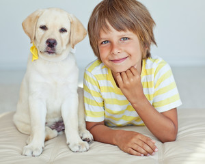 A child with a dog.