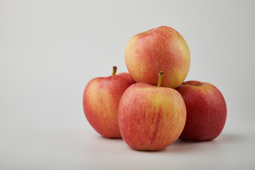 Ripe juicy red apples on white background