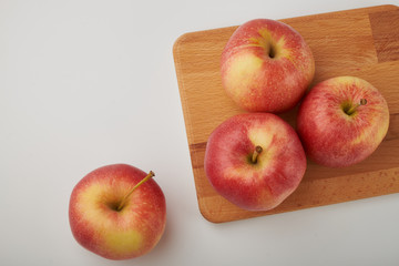 Ripe juicy red apples on white background