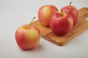 Ripe juicy red apples on white background