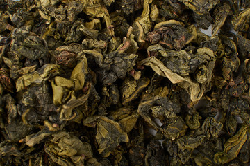 Dry and fresh tea leaves isolated on white