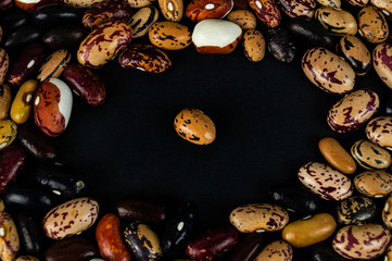 Different beans haricot scattered on the table. Natural products.