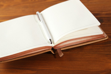 Brown notebook on a wooden table