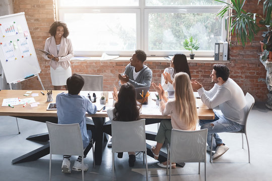 Black Woman Making Marketing Presentation To International Business Team