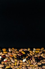 Different beans haricot scattered on the table. Natural products.