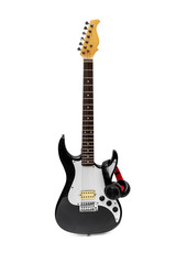 Electric guitar with headphones on a white background.
