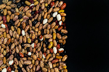 Different beans haricot scattered on the table. Natural products.
