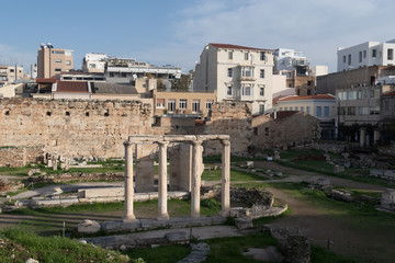 Fototapeta na wymiar Athens, Greece - Dec 21, 2019: Remains of the Gate of Athena Archegetis and Roman Agora in Athens, Greece.