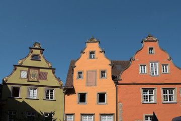 Fototapeta na wymiar Schwäbisch Hall, Germany - July 25, 2019; Colorful houses on the market square on the touristic town Schwäbisch Hall, on the romantic road in Bavaria