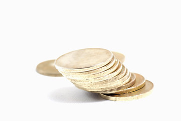 Close up shot of stacked golden coin isolated