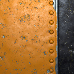 Rusty metal strip with rivets on the left against on black metal background 3d