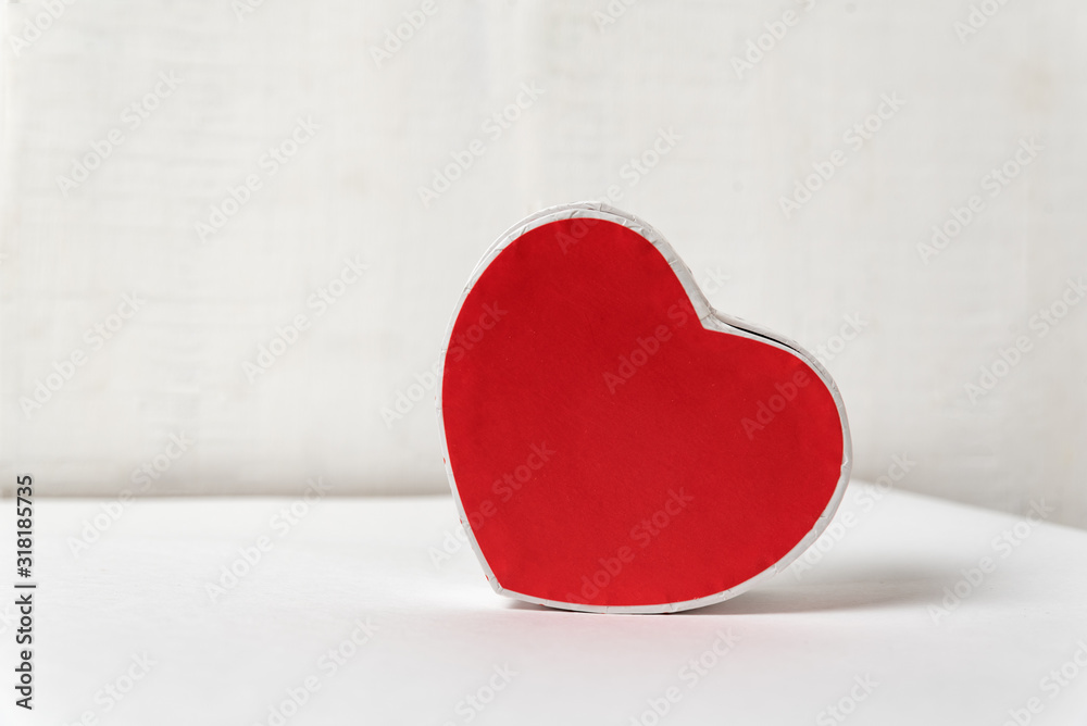 Wall mural Red heart shaped box close up. Side view. Space for text. Valentine's Day