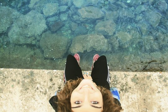 Directly Above View Of WOMAN LOOKING AT CAMERA