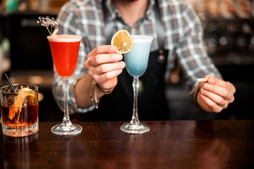 Close up details of working bartender in bar