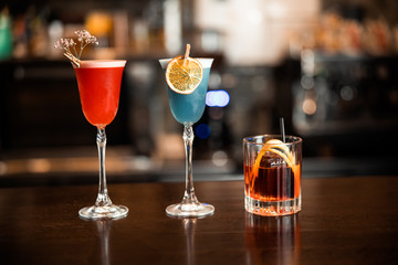 Close up of multi-colored cocktails at the bar counter