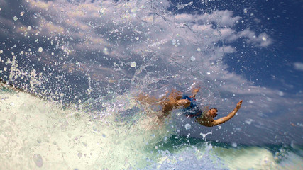 Surfer gets thrown off the surf board in a spectacular wipe out