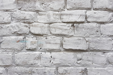 Old red brick wall with damaged white paint layer, closeup background photo texture. Seamless composition