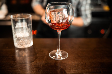 Alcoholic beverage with ice at the bar counter