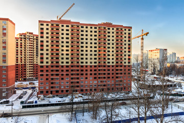 House construction and crane Proletarskay street in Zheleznodorozhny town in Moscow Oblast, Russia....