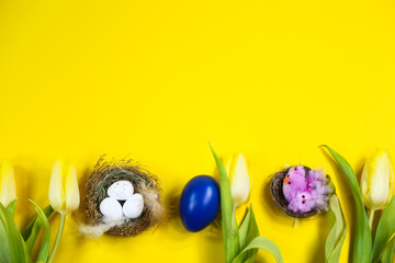 Tulips, Easter egg, Easter basket on yellow background