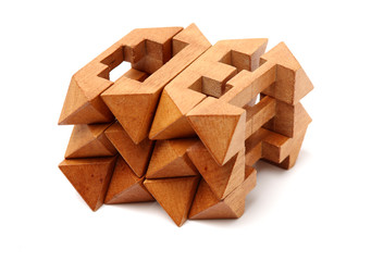 wooden puzzle over white background