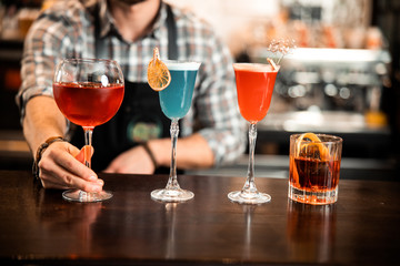 Colorful exotic alcoholic cocktails in the bar