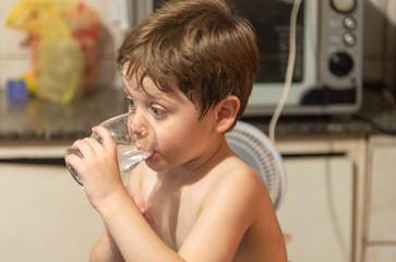 Brazilian boy drinking water