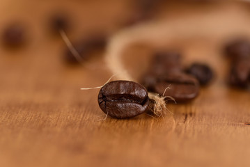 roasted coffee beans on wooden table, close up