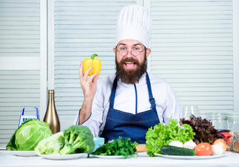 Food for dinner. Chef man in hat. Secret taste recipe. Dieting and organic food, vitamin. Bearded man cook in kitchen, culinary. Healthy food cooking. Vegetarian. Mature chef with beard