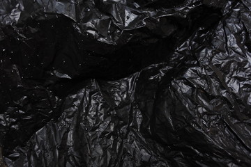 black plastic bag on dark background